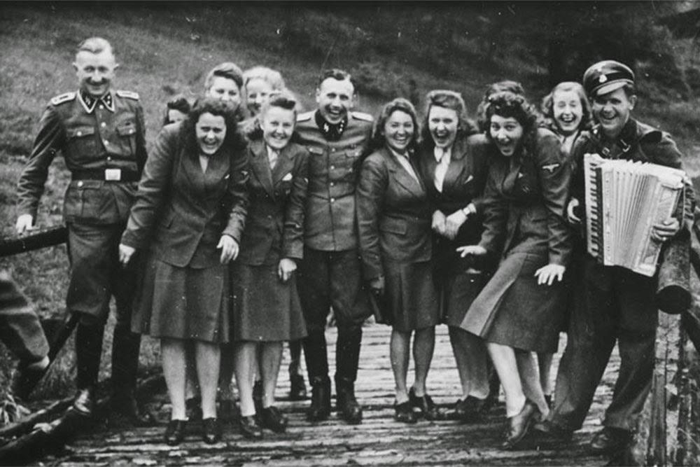Nazis laughing at Auschwitz.