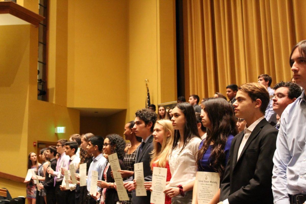 NHS inductees recite the NHS induction pledge after president senior Nithya Kasarla. (Photo/ Kayla Rubenstein)