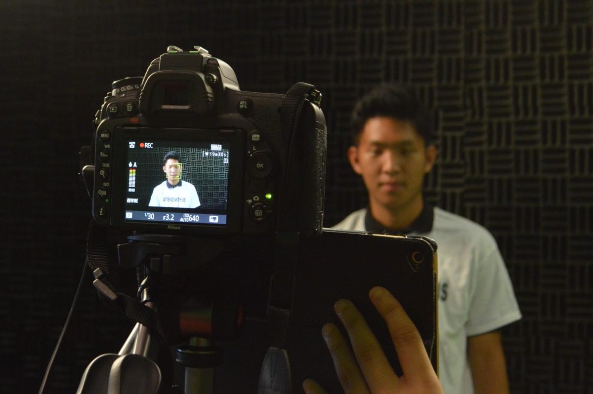 Senior Min-Kyu Kim recites lines for the video while wearing a #ItEndsWithUs t-shirt. (Photo/Joanne Haner)