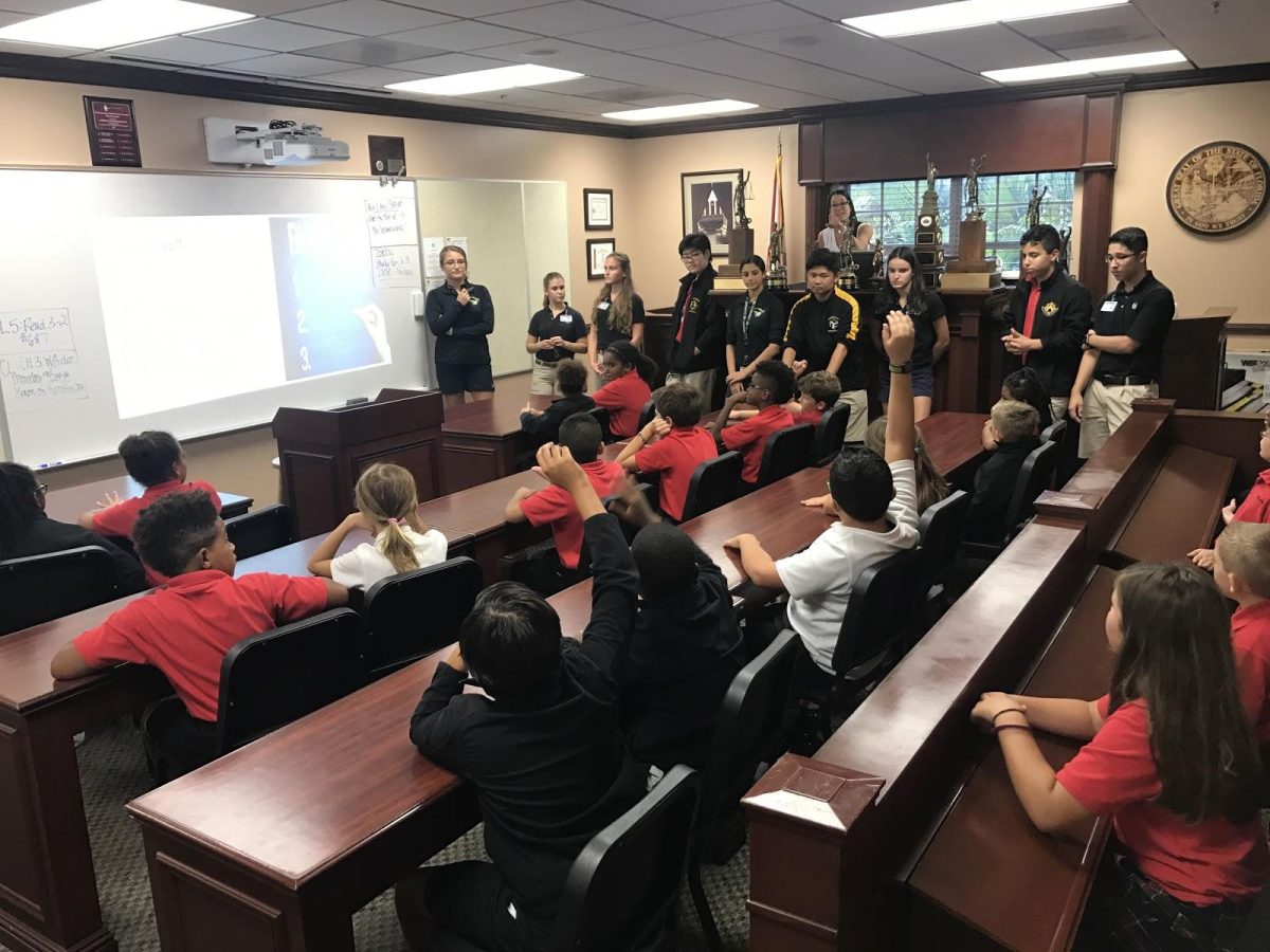 Mrs. Kapit’s criminal law students take the fourth graders questions amid their presentation. (Photo/Sloane Kapit)