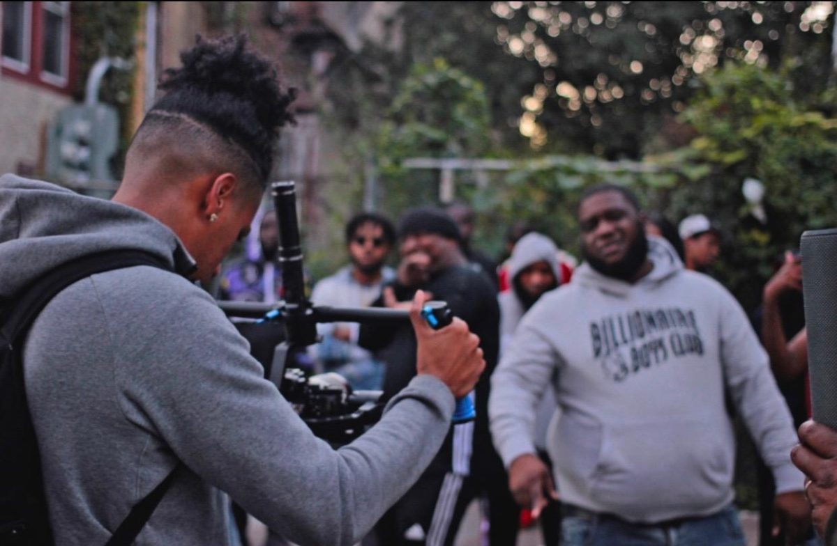 Senior Cassius Jennings uses a camera stabilizer while filming music videos. Jennings used the money he made from music videos to buy equipment to make better quality videos. (Photo submitted by Cassius Jennings)