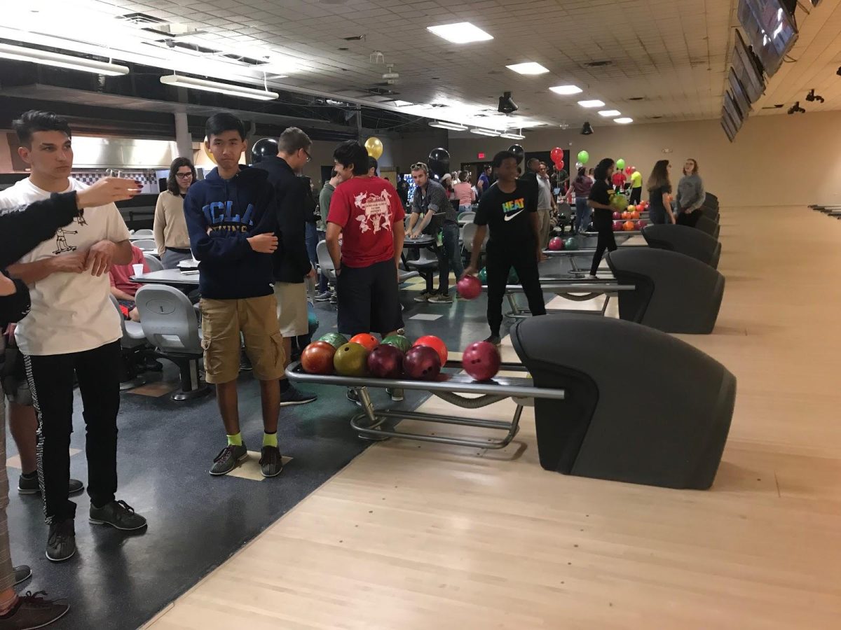 Pre-Law members bowl in celebration of all the gifts they collected. (Photo/Kristen Quesada)