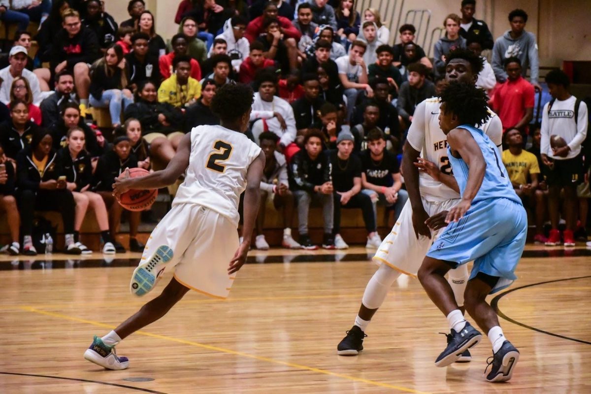 Junior Zaire Wade (2) works around the court versus Somerset Academy in their home opener. Wade finished with 19 points to seal the win. (Photo/Alycia Cypress)