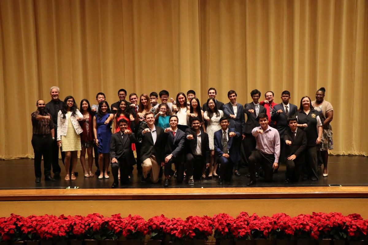The Mu Alpha Theta team and faculty pose with their rings at the end of the ceremony. (Photo/Joanne Haner)