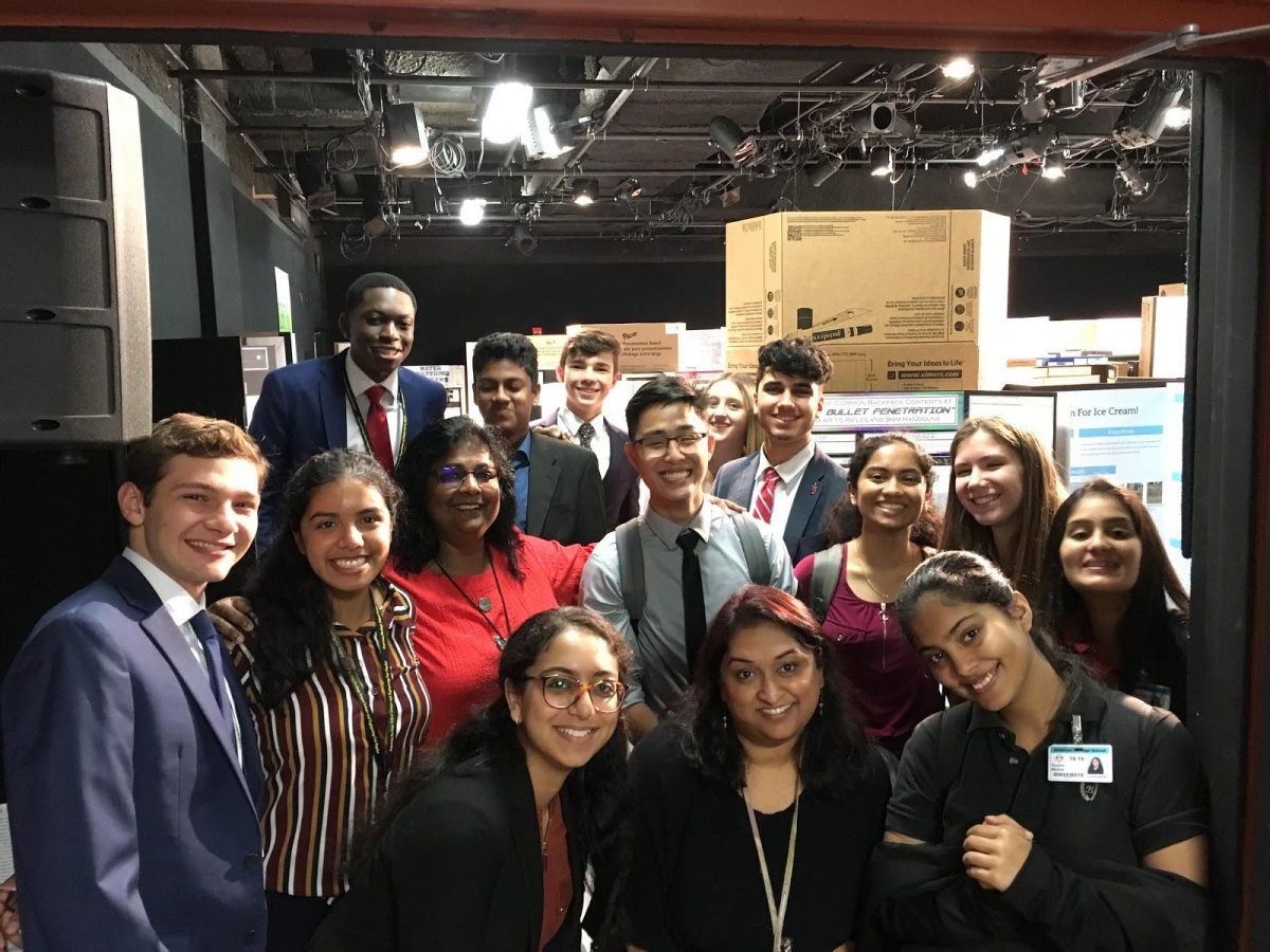 Student researchers finally de-stress after months of preparing their projects for the fair. Accompanied by Mrs. Leya Joykutty and Dr. Diana Sood, they snap a final photo before the fair ends. (Photo submitted by Leya Joykutty)