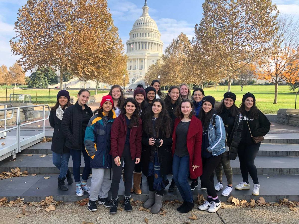 Students from American Heritage publications stand in front of the Capitol building as they await a tour of the building. (Photo/Ms. Diana Adams)