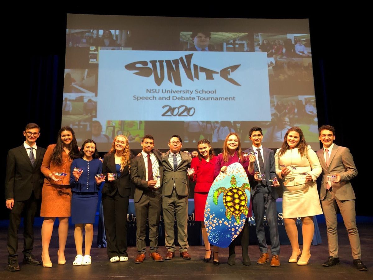 Students smile and pose for a picture, holding their awards for finaling in their event. “Doing this good at a nationally recognized tournament like sunvite made us really proud and we hope to just move forward from this point,'' junior Lincoln Douglas debater Anika Dham. (Photo/submitted by Anika Dham)