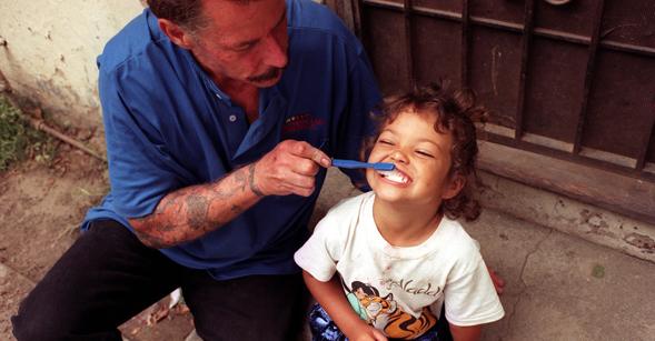 ME.orphansD1.2.1106.CW ÒJohnny, brush her teeth first. My gums are bleeding,Ó said Theodora Triggs, 33, not in Photo, who is the young girls mother and a HIV positive drug addict.Photo/Art by:Clarence Williams