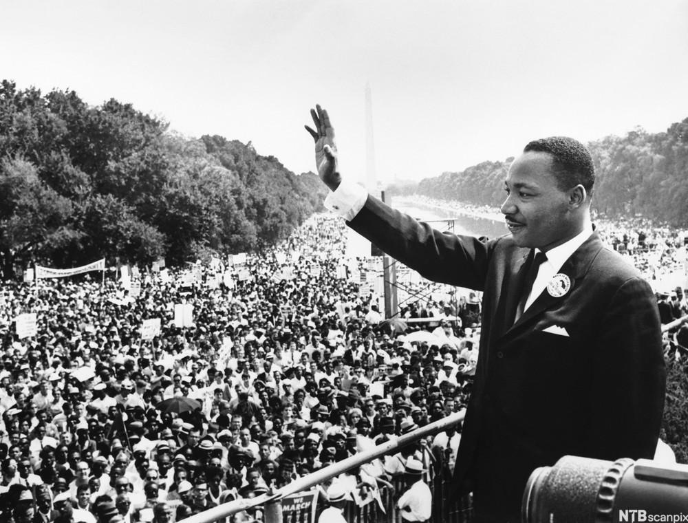 28 Aug 1963, Washington, DC, USA --- Reverend Martin Luther King, Jr. waves to participants in the Civil Rights Movement's March on Washington from the Lincoln Memorial. It was from this spot that he delivered his famous "I Have a Dream" speech on August 28, 1963. --- Image by © Hulton-Deutsch Collection/CORBIS