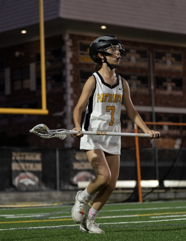 She’s only 12? Sixth-grader Raqui De Marchena battles on the varsity lacrosse team