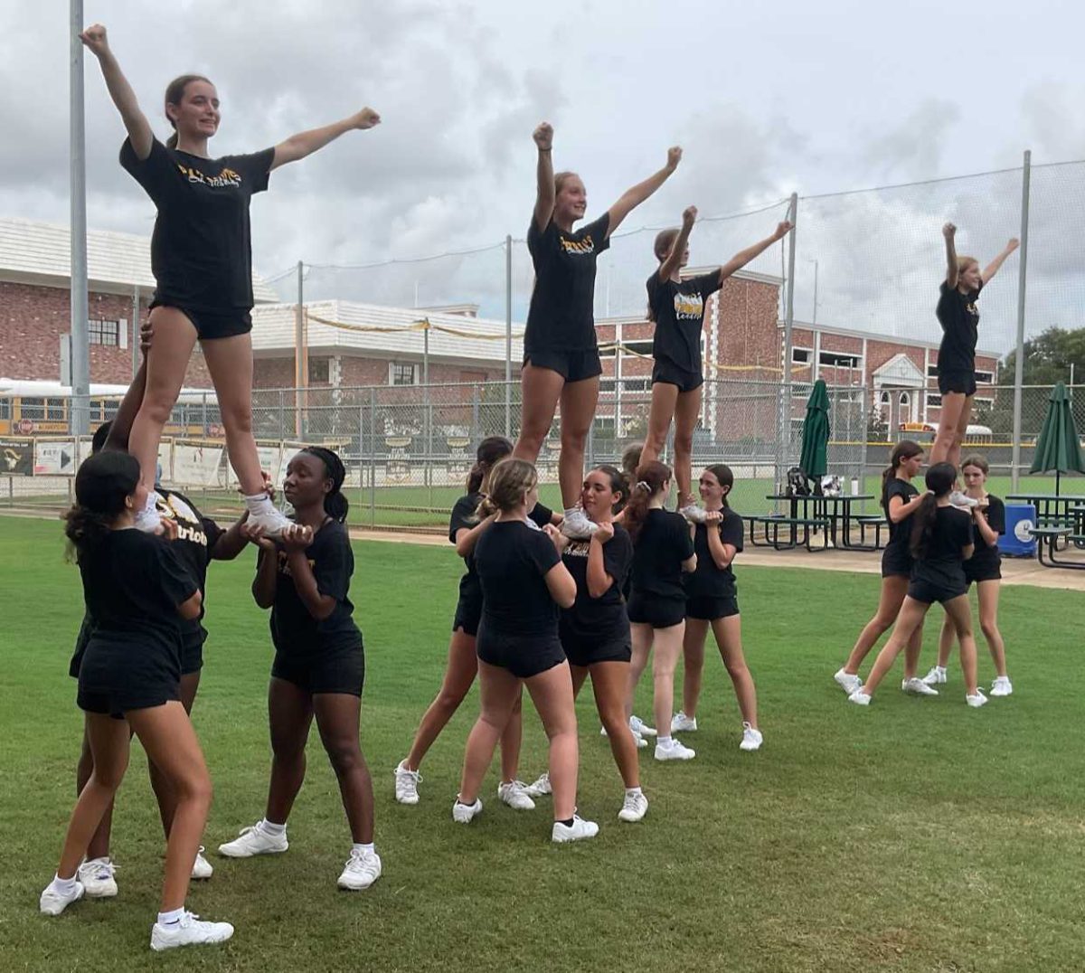Lifting each other to new heights: A look at junior varsity football cheer